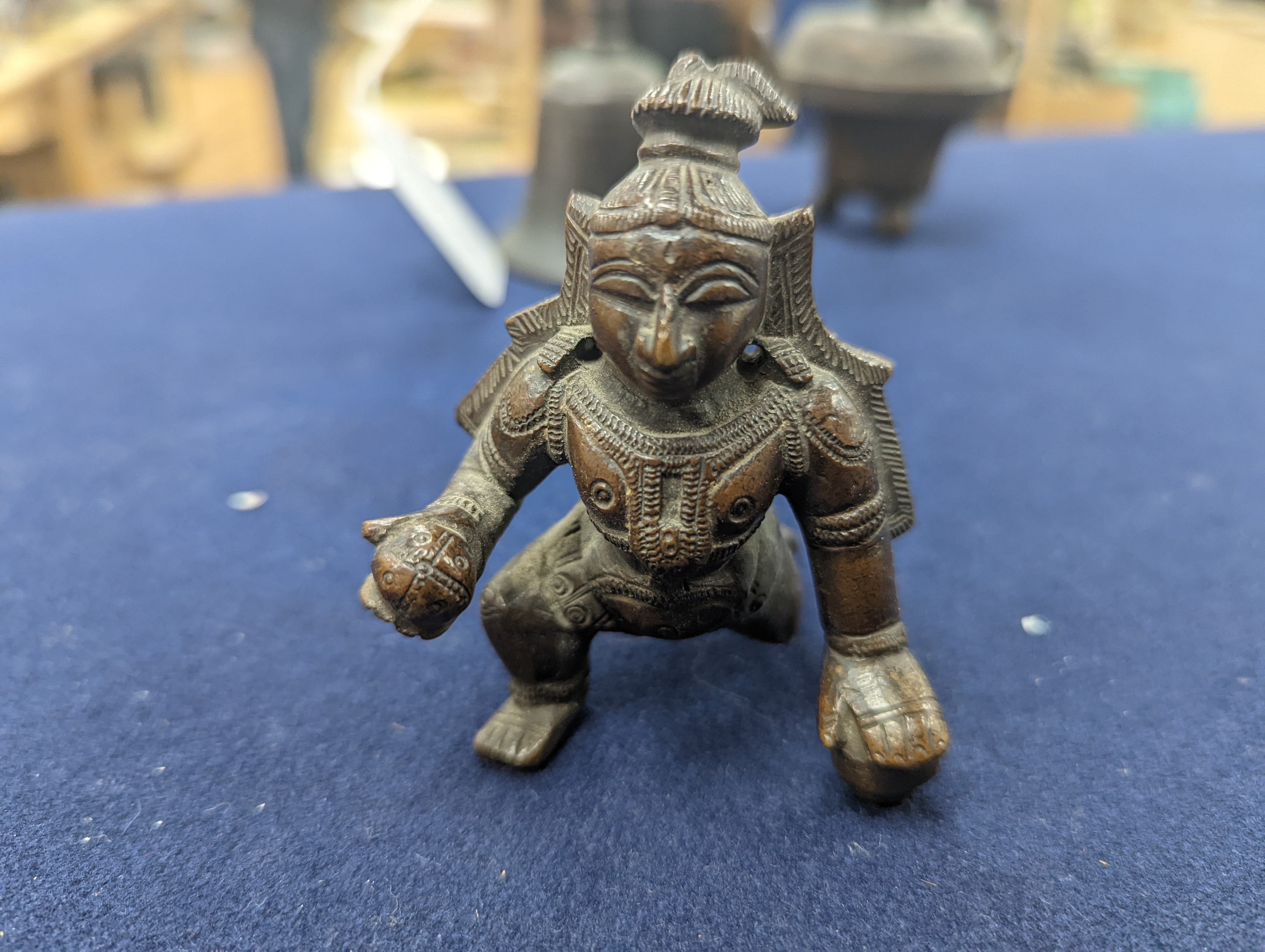 A Chinese gilt copper figure, a Chinese Dog of Fo, a bell, a censer, six Indian bronze figures and a scroll box
